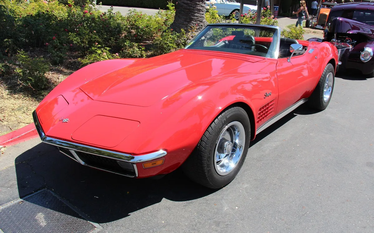 The dream, for the man in cargo shorts: a red Corvette convertible, roof down.