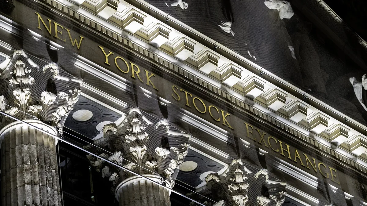 The carved New York Stock Exchange lettering above the Corinthian columns on Broad Street, Manhattan