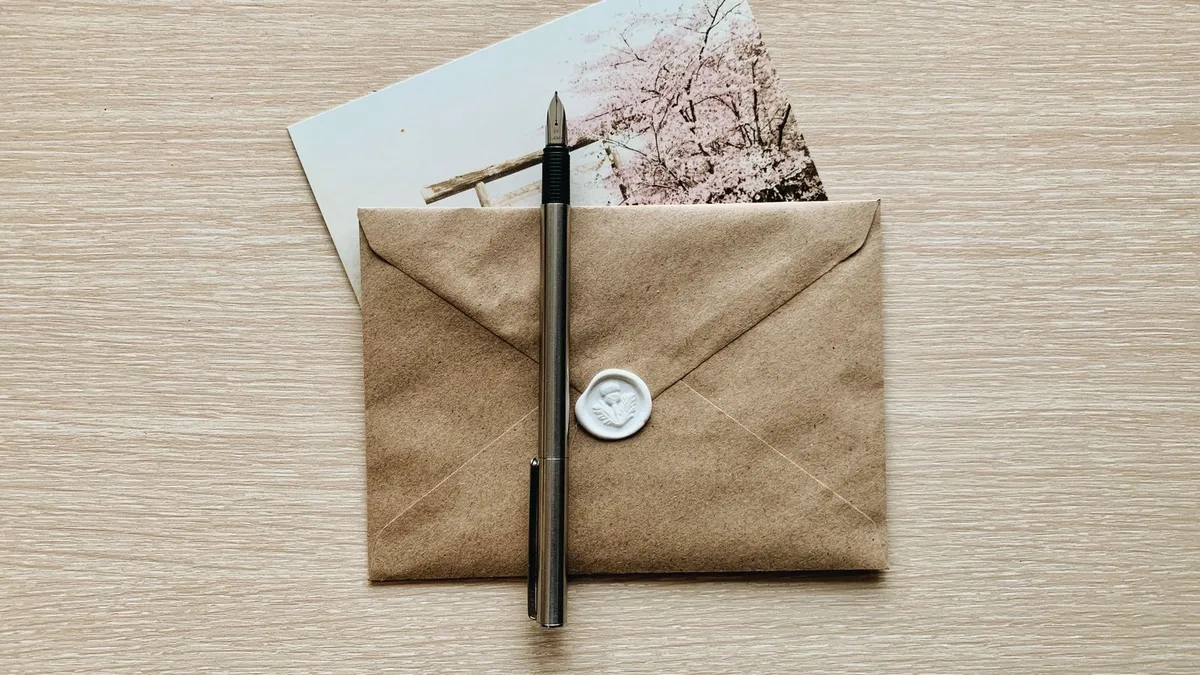 A sealed letter on a leather desk