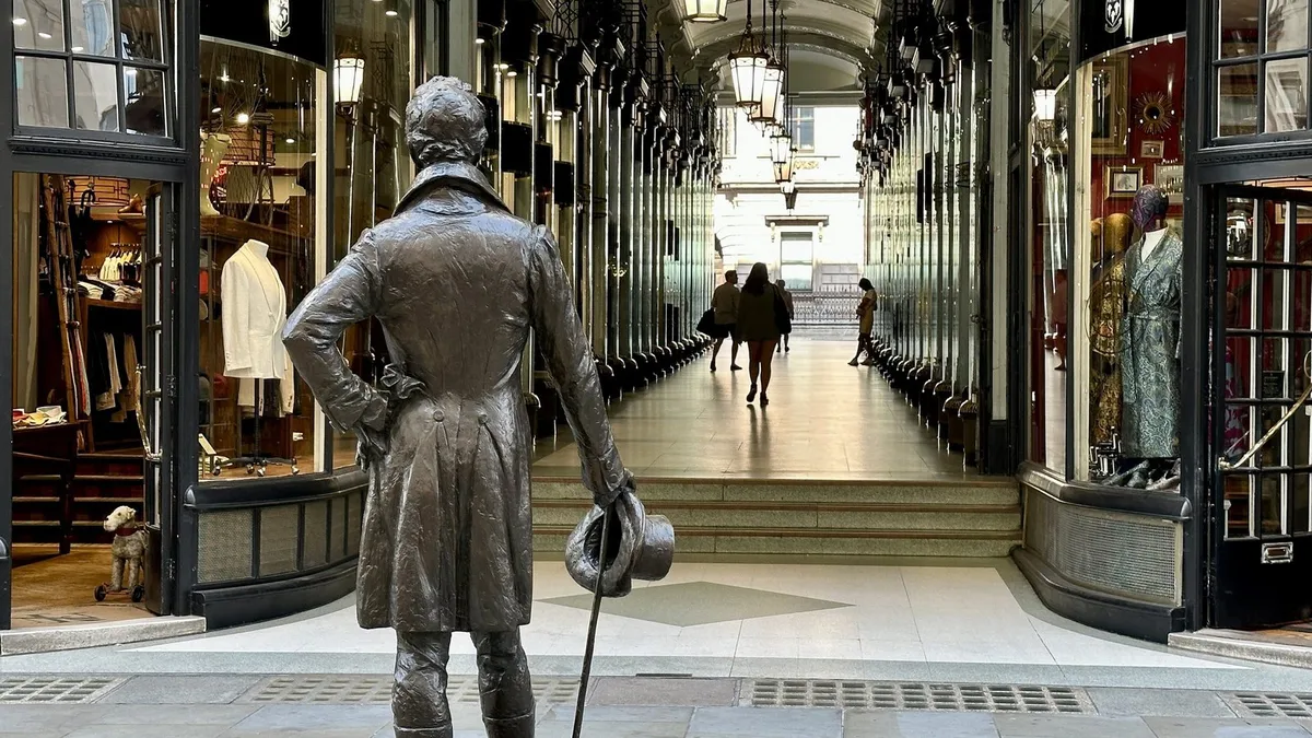 Bronze statue of Beau Brummell outside the Piccadilly Arcade on Jermyn Street, London