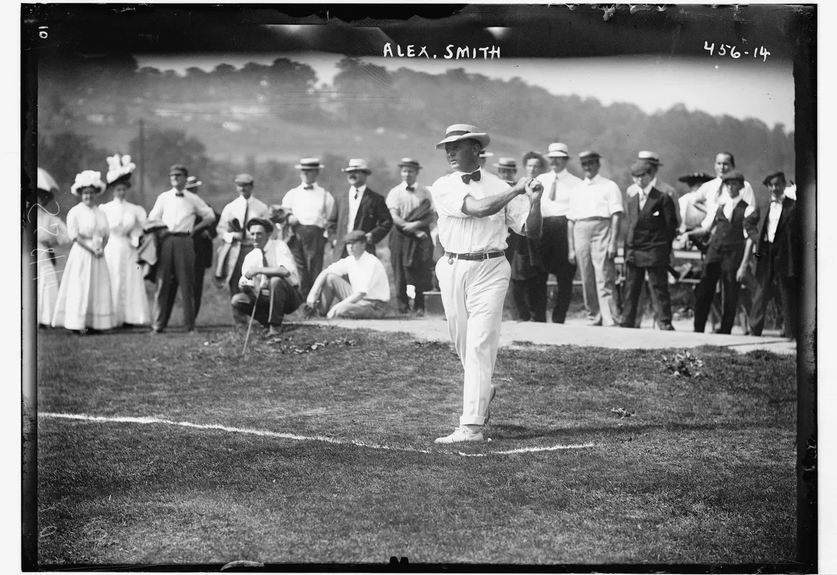 A golf match in 1908, when the swing was still performed on the course rather than beside a desk.