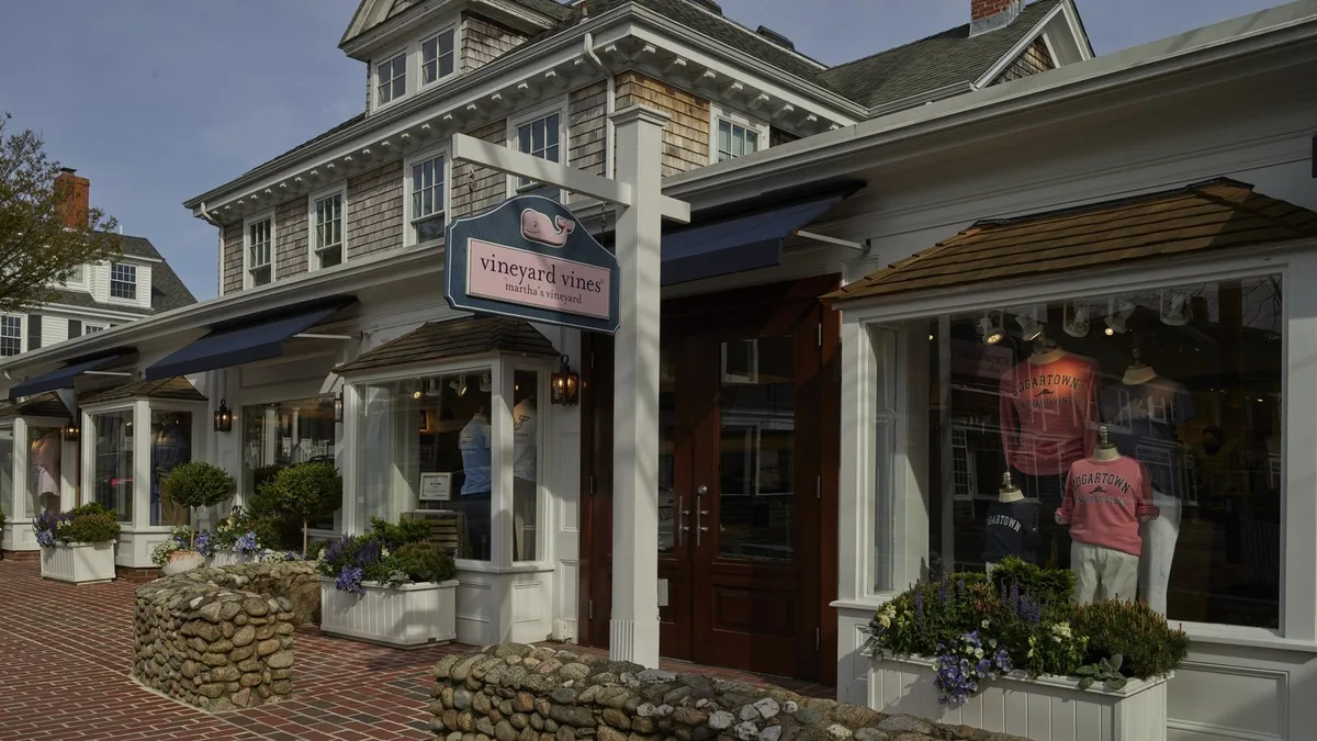 The Vineyard Vines shop on a brick street in Edgartown on Martha's Vineyard, with pink and white shirts in the window