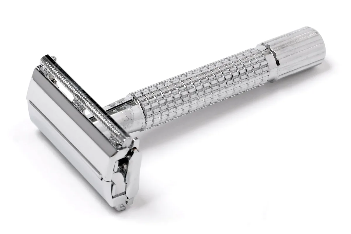 A chrome double-edged safety razor. One blade, properly weighted, gives a closer shave with less irritation than a cartridge of five.